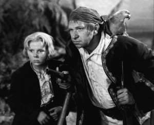 Jackie Cooper, as Jim Hawkins, hangs out with his buddy Wallace Beery, as Long John Silver, in "Treasure Island."