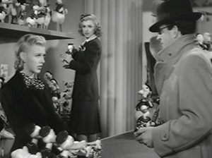 Ginger Rogers, left, works at the wind-up duck counter in "Bachelor Mother."