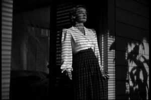 Bette Davis comes out of her bungalow in "The Letter."