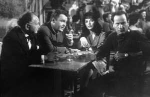 Edward G. Robinson, Rod Steiger, Joan Collins and Eli Wallach plan a casino heist in "Seven Thieves."