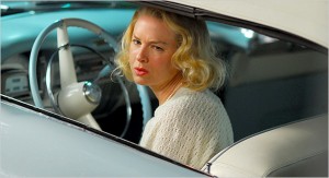 Renée Zellweger behind the wheel of a blue Cadillac in "My One and Only."