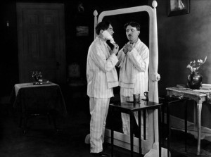 Max Linder (left) performs the mirror gag in "Seven Years Bad Luck."